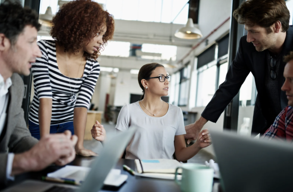 Team of professionals collaborating in an office meeting to delegate business tasks effectively